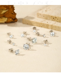 Close-up of S925 sterling silver stud earrings with round moissanite in various sizes