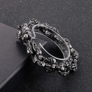 Macro shot of punk style skull link bracelet in vintage finish stainless steel