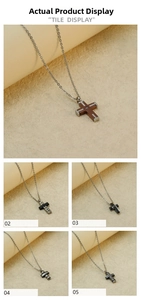 Detail view showing five titanium steel cross necklaces with diverse minimalist textures