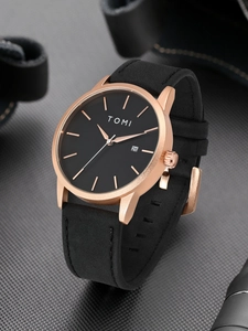Detailed side view of black dial quartz watch with date window and rose gold case