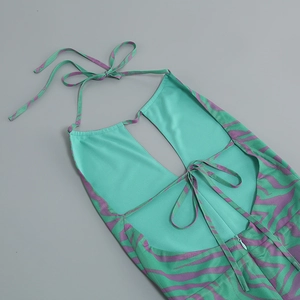 Detail of the backless halter dress with mint green tiger print and invisible zipper