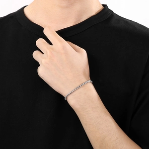 Detail of 3.5mm stainless steel box chain necklace worn on a male wrist with silver finish