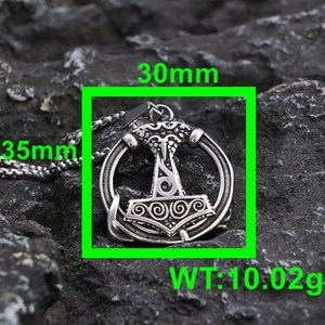Detail view of Viking Mjölnir pendant showing dimensions 30mm x 35mm on rock background