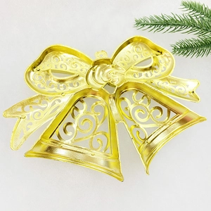 Golden double Christmas bell ornament with a decorative bow for festive tree decorations