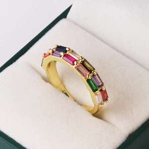 Detail of 18K gold plated ring with double row colorful baguette cubic zirconia