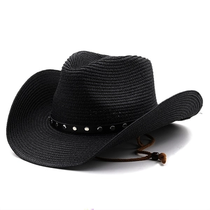 Detail of black woven straw cowboy hat with silver studded leather band and chin strap