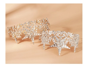 Close-up of gold and silver bridal crowns featuring sparkling rhinestone star patterns