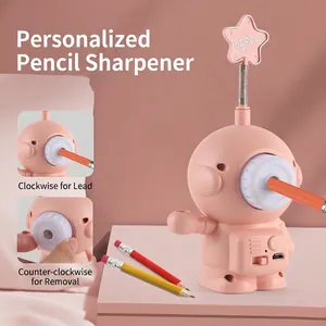 Pink astronaut pencil sharpener with LED light and USB port for kids' desk decor