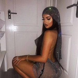 Close-up of sparkling silver mesh headpiece and halter dress with shiny rhinestones