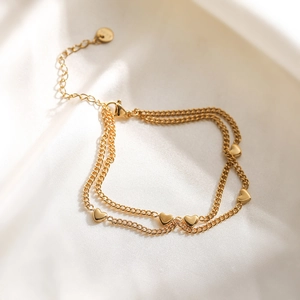 Elegant 18K gold plated double layer heart charm bracelet on smooth white silk