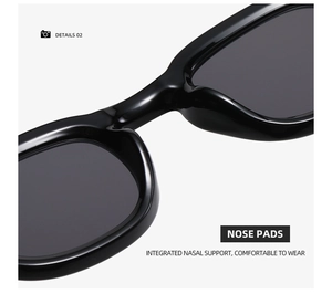 Detail view of smooth integrated nose pads on black retro round sunglasses