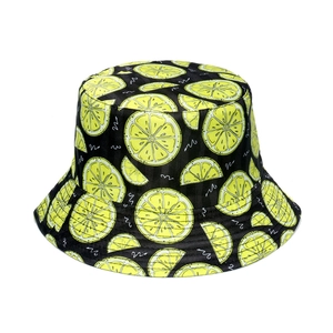Detail shot of black bucket hat with lemon fruit print and white wavy pattern