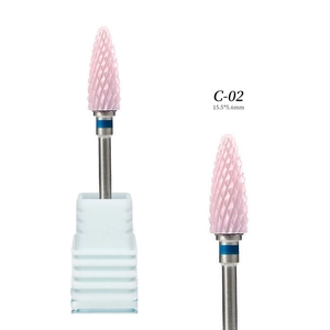 Detail view of pink ceramic bullet nail drill bit with spiral texture and metal shank