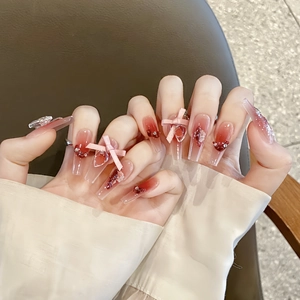 Dark red gradient coffin press-on nails with 3D bows and sparkling rhinestone accents