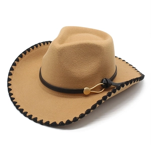 Detail of camel wool felt fedora with black stitched edge and leather hat band buckle