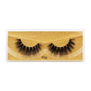 Detail of 3D faux mink eyelashes style #105 on a gold glitter tray with natural volume