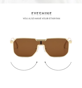 Detailaufnahme der goldenen Metallfassung Sonnenbrille mit braun getönten Gläsern