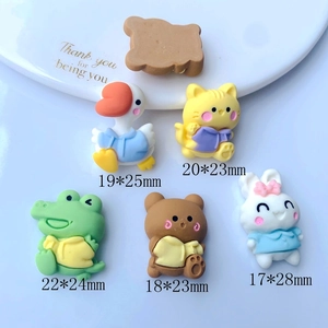 Close-up of colorful resin cartoon animals for DIY phone case crafts and accessories