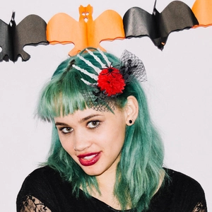 Halloween skeleton hand hair clip with red rose and black mesh on green hair