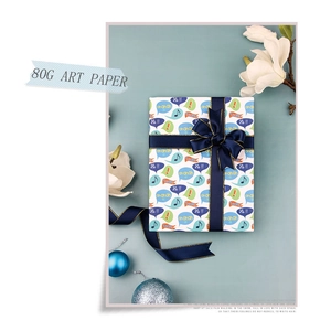 Detail of 80G art paper gift wrap with music notes and a navy blue ribbon bow