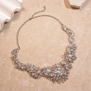 Detailed view of silver leaf branch necklace featuring faux pearls and adjustable chain