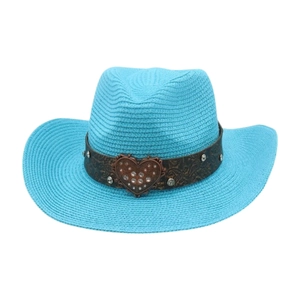 Detailed texture of blue straw cowboy hat with rhinestone heart buckle and embossed band