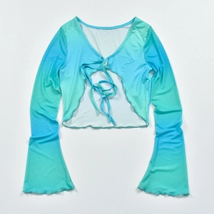 Detail of blue-green ombre mesh cropped top with tie-front and flare long sleeves
