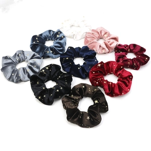 9-piece gold star velvet hair scrunchies set in assorted colors with celestial patterns