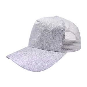 Close-up of silver glitter sequins and breathable mesh on a stylish baseball cap