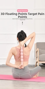 Pink massage roller with bionic nodes for deep muscle relaxation on the back