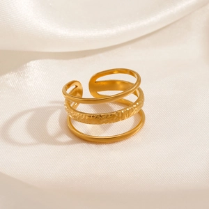 18K gold plated stainless steel triple layer open ring on elegant white silk background