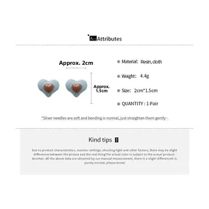 Detail showing blue denim heart earrings dimensions and silver needle specifications