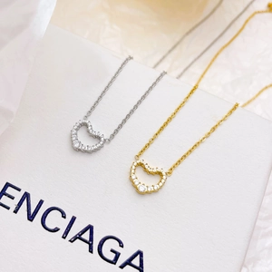 Elegant hollow heart necklace with sparkling crystals in gold and silver finishes