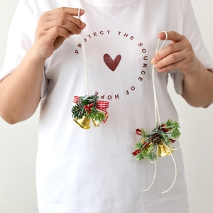 Christmas pine cone bells hanging ornament with red berries and bow for tree decoration