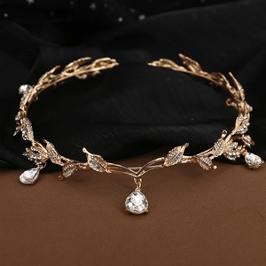 Detail of golden leaf bridal crown with sparkling rhinestones and crystal pendants