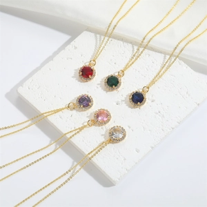 Classic round halo gemstone pendants in six vibrant colors with delicate gold chain