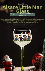 Macro shot of lead-free glass wine goblet with colorful Alsace folk art and green stem