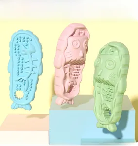 Detailed view of fish-shaped pet chew toys in blue, pink, and green colors with textures