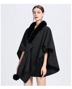 Detail of faux rabbit fur collar and knit texture on dark grey cape cardigan