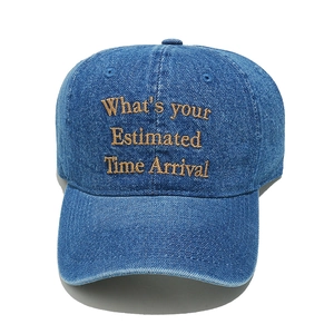 Classic washed denim baseball cap with embroidered lettering and adjustable sun visor