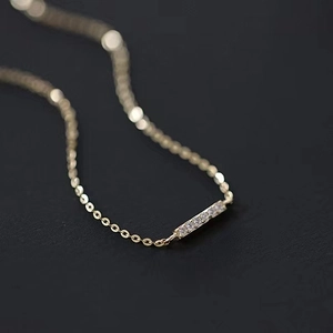 Minimalist S925 sterling silver bracelet with 14k gold plating and diamond bar charm