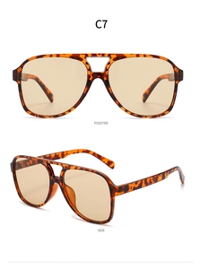 Detail view of tortoiseshell aviator sunglasses with yellow lenses and double bridge design