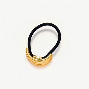 Detail of black elastic hair tie with a luxury gold U-shaped stainless steel metal buckle