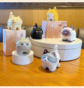 Detailed set of six resin cat figurines with wood-carved geometric finish in original box