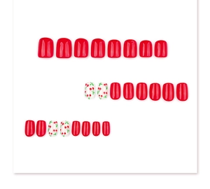 Detailed view of short square red and cherry print glossy press-on nail set display