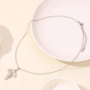 Detail of silver stainless steel elephant pendant on fine chain with extension