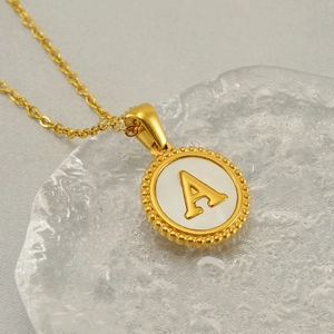 Classic gold stainless steel necklace featuring a vintage round letter A pendant