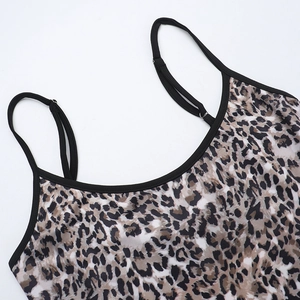 Close-up of leopard print camisole dress with black spaghetti straps and U-neck detail