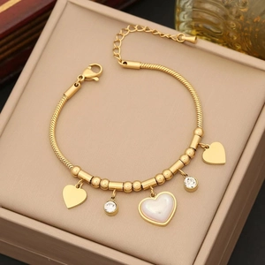 Gold stainless steel snake chain bracelet with heart pendants and zircon stones in a box