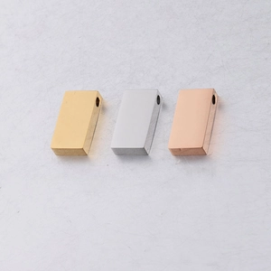 Detailed view of rectangular stainless steel beads in gold, silver and rose gold finish